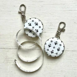Graphic Tape Measure With Key Clip 11 Graphic Tape Measure With Key Clip -loop knitting store Fleur de Lys key chain tape measure at Loop London